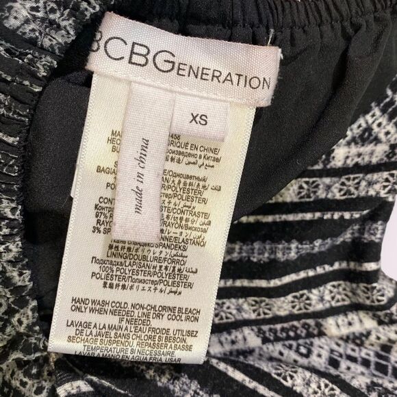 BCBGeneration Sleeveless Wide Leg Jumpsuit Size XS Sheer Black Print Summer Chic - Picture 12 of 13